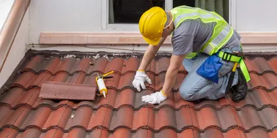 man working on roof